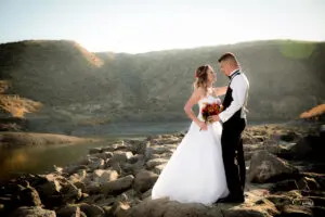 A wedding photo by the rocks