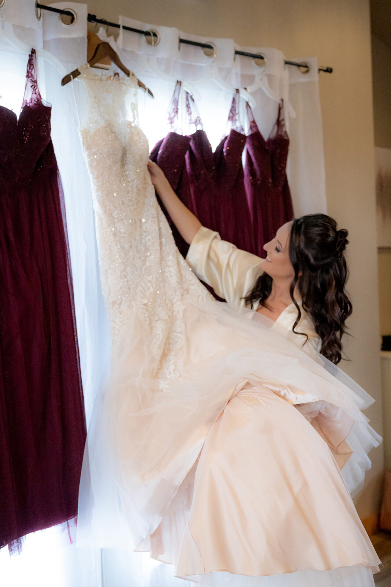 A bride looking at her wedding dress