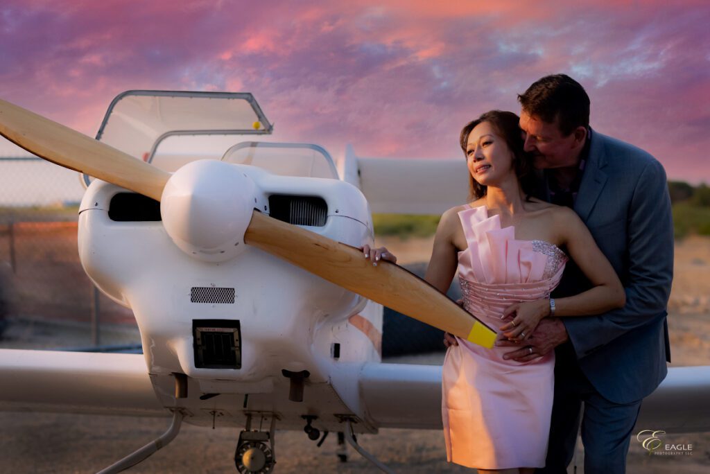 A couple’s photo with a plane