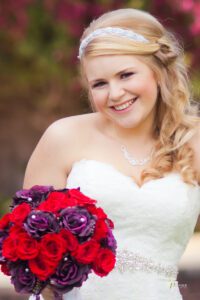 A bride holding a bouquet of roses