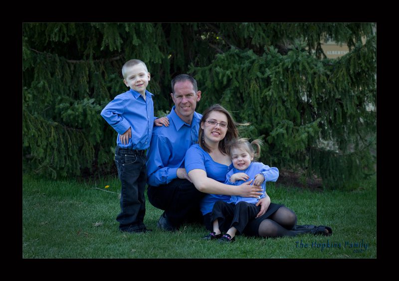 A family wearing blue