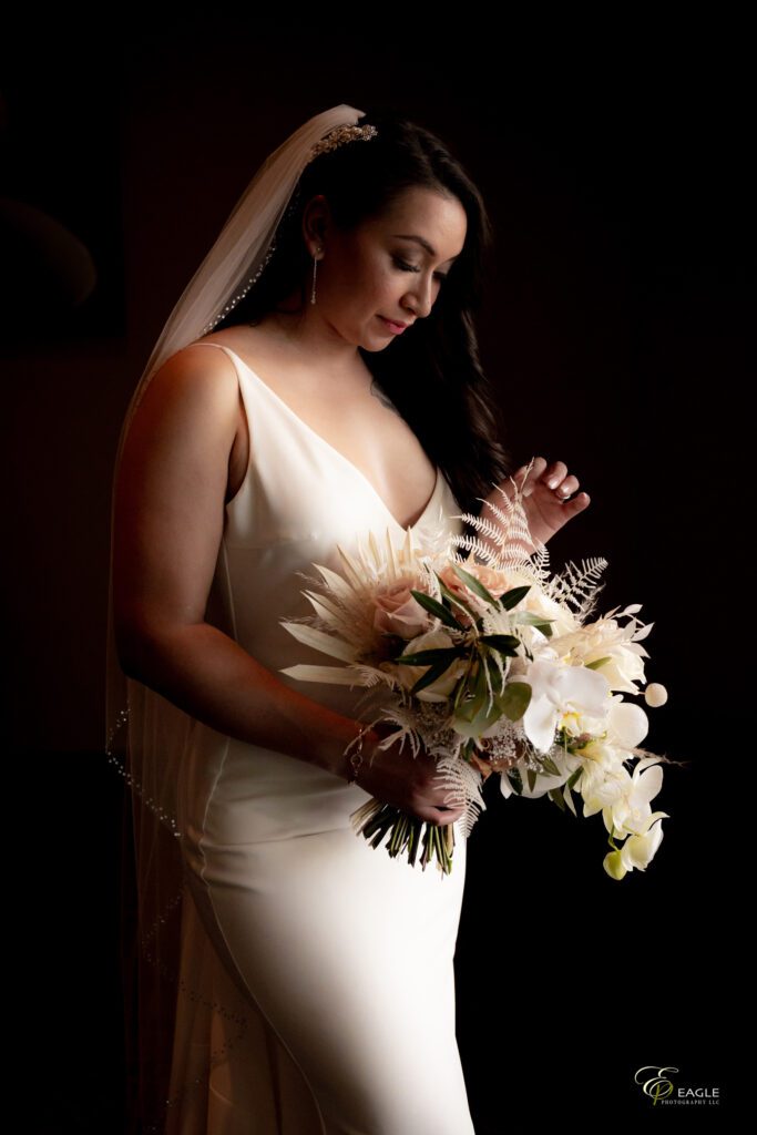 A bride in white dress posing for wedding photography
