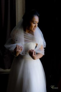 A beautiful bride fixing her veil